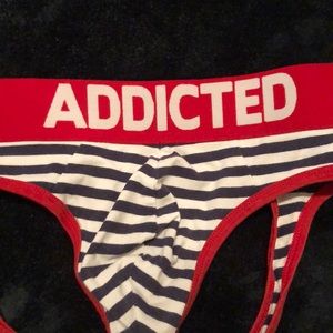 Addicted jock!  Thick red band with trim. Navy and white trim.